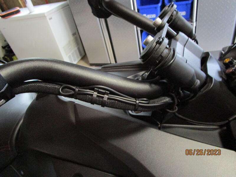 phone cable zip tied to cable