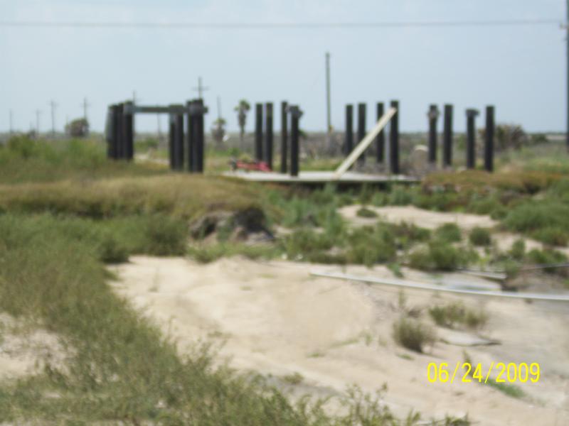 Pilings minus the house. Many like this on Boliver Beach.