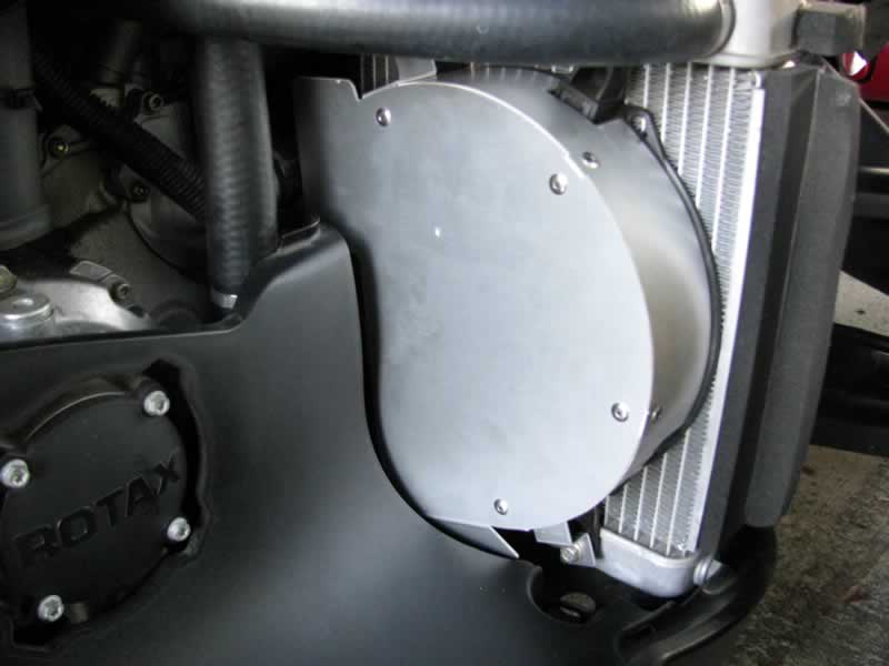 Put Fan Can in and slide the notches between the loosened bolts, then tighten the bolts.