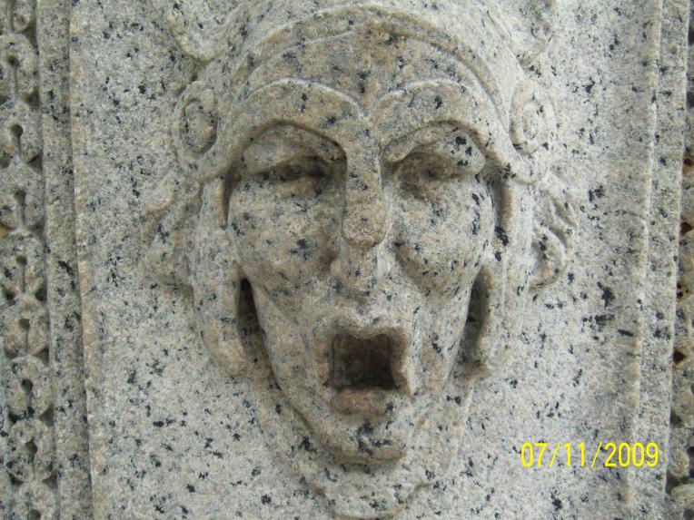 Raised face on Victory Arch.