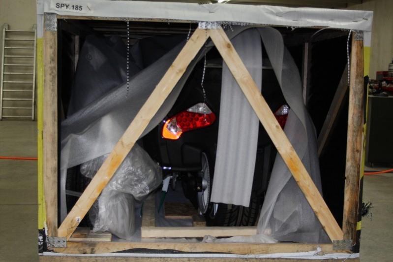 Rear end of crate, tail lights seeing their first view of the U.S.