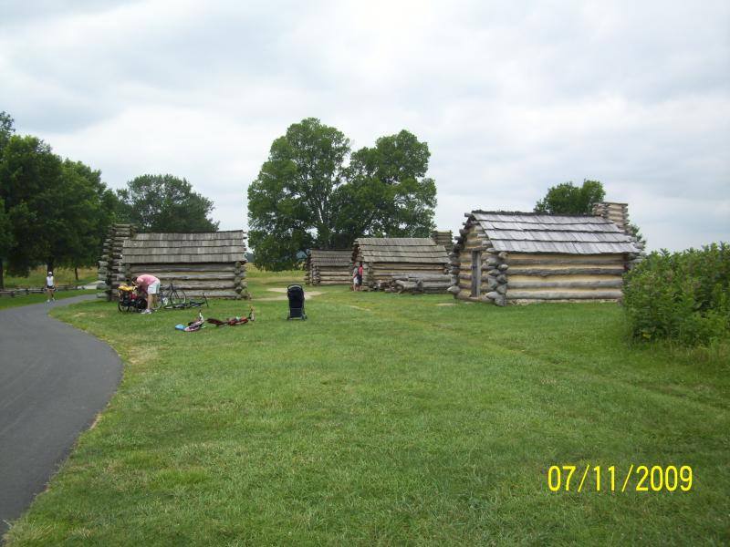 Replicas of cabins built to shelter soldiers.  VF, PA