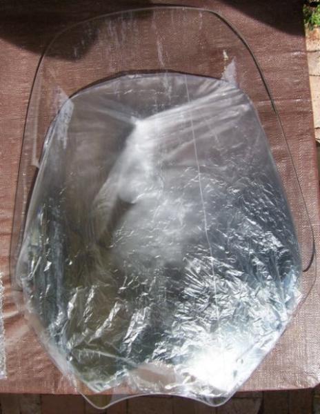 RoboBrackets 20" windshield. My BRP Sport Touring shield is wrapped in plastic under the new shield so you can note the difference in size.