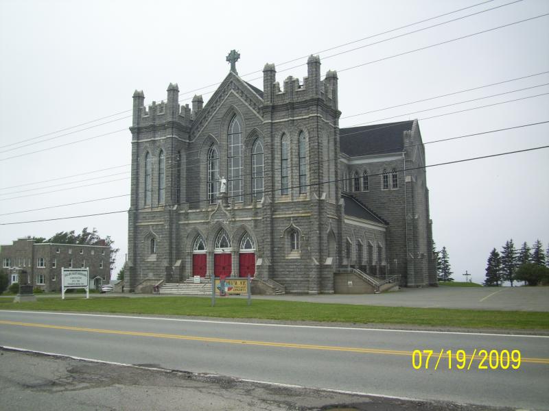 Saint Bernard church. Constructed between 1910-1942 by local resident; made of granite blocks. Seats 1000 people. On the Acadian Shores Drive in Nova 