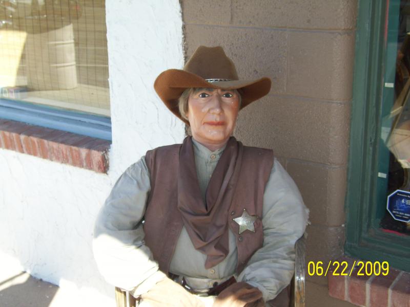 Sheriff sitting on porch of Mercantile, Willcox, AZ