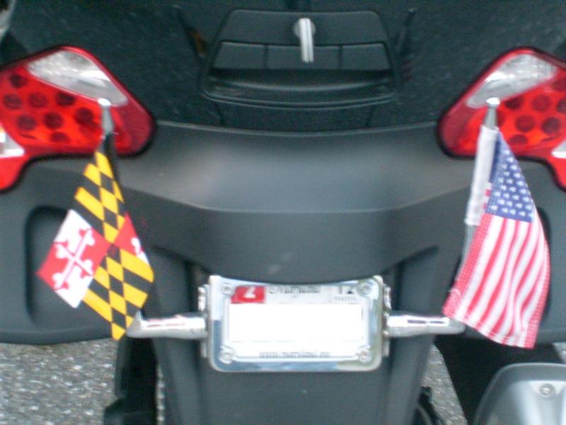 So okay ... if you get those Kuryakyn licence plate frame mounts, the "kit" comes with either a 4 1/2 x 8 1/2 USA or POW/MIA flag.  NOBODY Else makes 