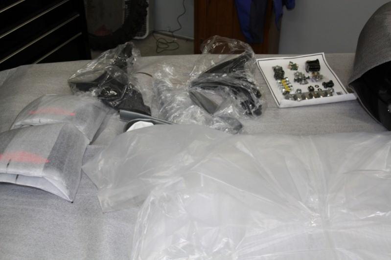 Some of the add on parts that were inside the nose assembly. Notice that all the required nuts, bolts and lug bolts are on a vacuum plastic sheet.