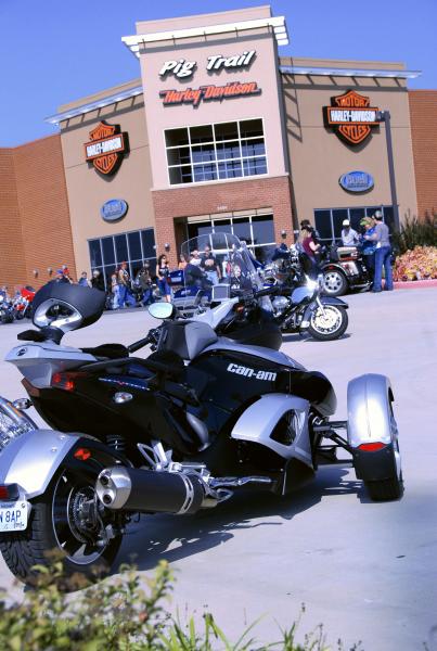 Spyder visits the Harley Davidson Dealership.  Ooops, got to leave now, everybody is pouring out of the dealership and asking "What model (HD) is that
