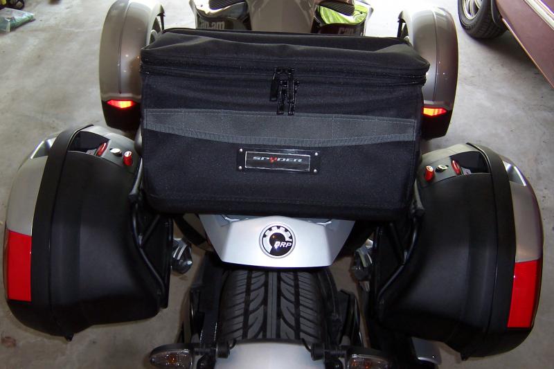 Stanley tool bag bolted to sport rack plate.  Carries rain gear, maps, spare parts.