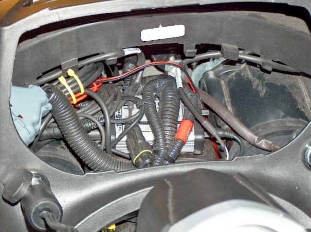 Starcom1 comm system installed under dash.  Radio and MP3 player cables in trunk.