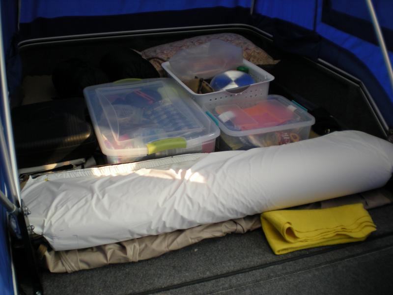 Storage of creature comforts + two lawn chairs which are not loaded in the trailer yet.  Inflatable mattress + egg crate cover for added R-value.