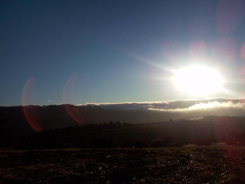 Sun setting over the fog that I rode out of