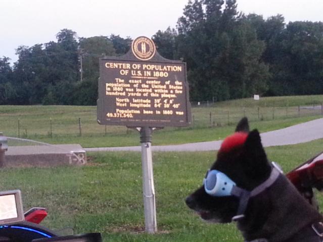 Teddy ryde'n redneck style with a stripped sled at the airport viewing area & marker showing the area was the center of population back in 1880