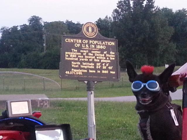 Teddy ryde'n redneck style with a stripped sled at the airport viewing area & marker showing the area was the center of population back in 1880