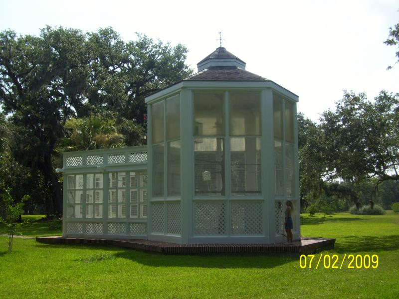 The aviary; no birds. Used to have parrots but they sickened and died.