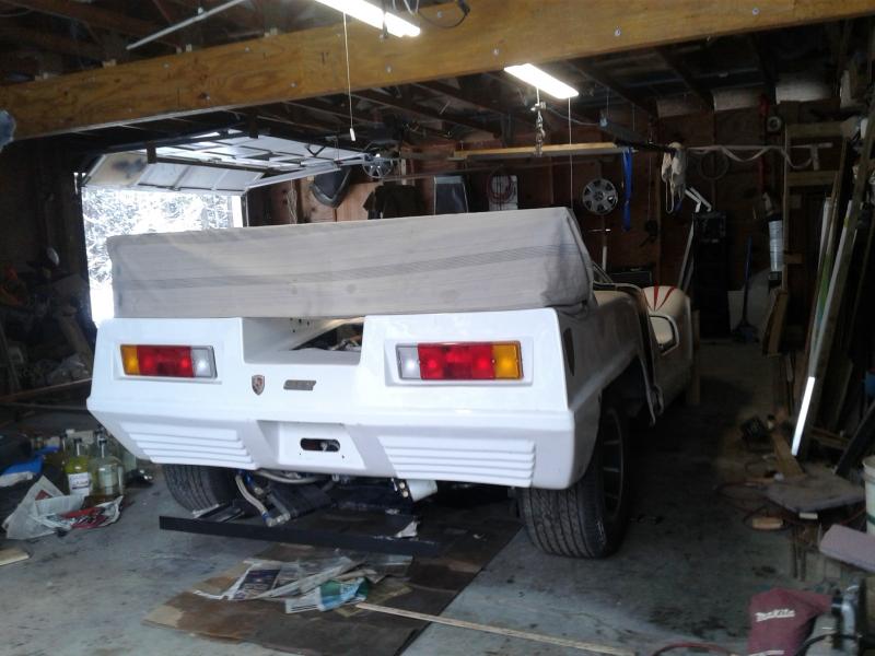 The cloth above the rear shows what the height of the orig car looked like ....the body is actually wher it's going to remain ...