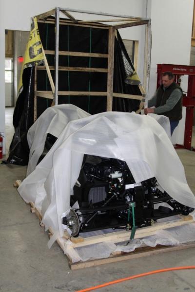 The crate has just been tilted off of it's base, front to rear. It was only connected to base by screws along the bottom.