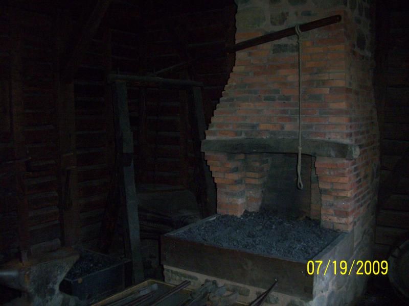 The forge. No coal so they first had to make charcoal...bellows, anvil, all authentic.