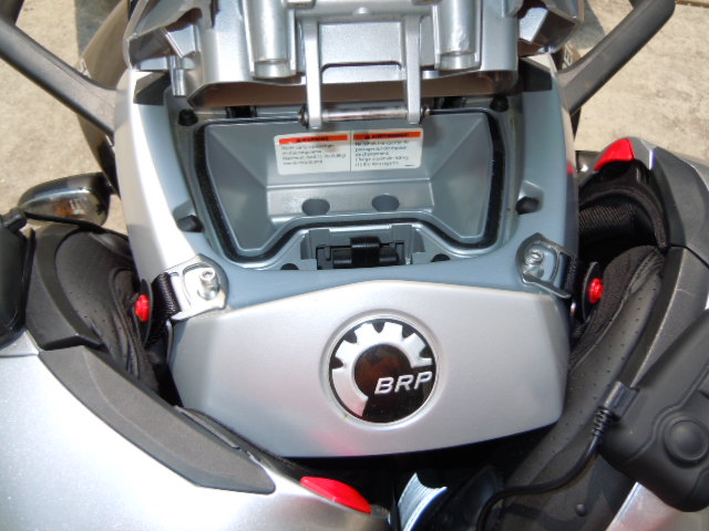 The helmets hang without holding them before closing backrest.