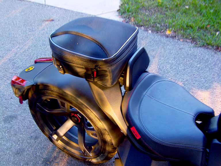 The Nelson Rigg tail bag is handy and fits using the hardware provided using a bit of creativity. Well made and solid strapped to the Max Mount.