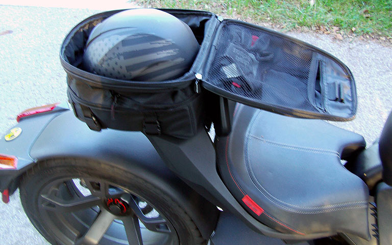 The Nelson Rigg trunk also expands to fit a half helmet and cool weather gear.