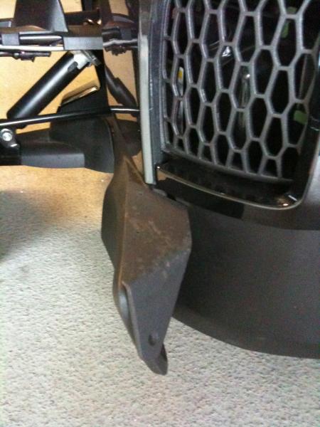 The Sopher custom foot rest; left side. A hidden brace is connected under to the inside frame securing the movement of the bracket and stiffens the en