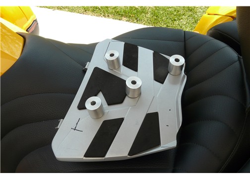 The spacers were set up so that they would not interfer with latches on the sport rack.  However, the bottom right bolt was drilled to go through this