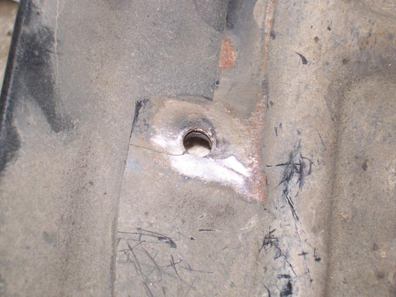 The upper right mounting hole