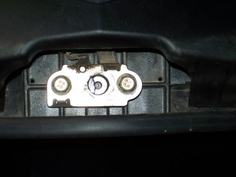 The washer stops the spring from being caught by the catch.