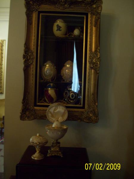 These are Emu eggs. The ones in the glass case are purses complete with straps, lockets on the outsides, and of course jewels.