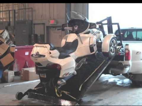 This is a Spyder being loaded onto a full-size truck.