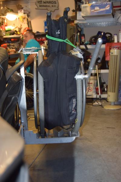 This is looking toward the back of the Spyder. I stuff my RoHo cushion between the wheels. The bungy is used just to clamp the backrest tighter togeth