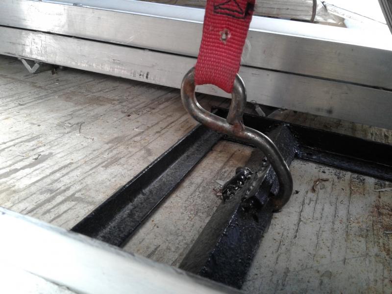 this is the hook end that attaches to the cradle,  bolted to the trk frame ....the strap goes over the top of the tire and the Ratchet end is attached