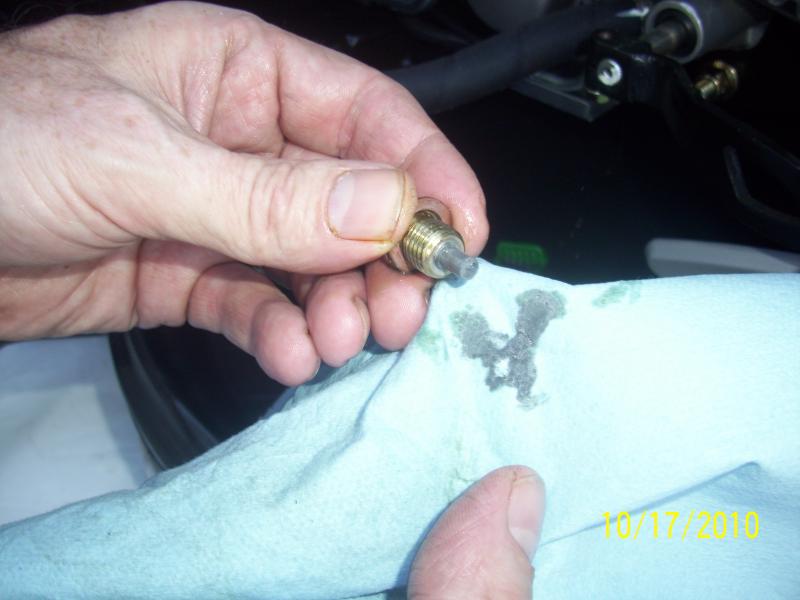 This is the plug magnet, nothing really unusual here. It looks like some engine assembly lube settled to the bottom of the sump. Any particulates wher