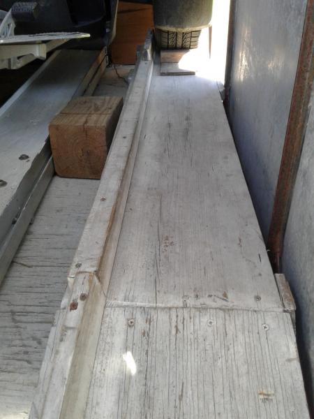 this is the right side plank  raised 4 in. to go above the wheel well metal ..... the higher added piece on the left side of the plank , keeps the tir