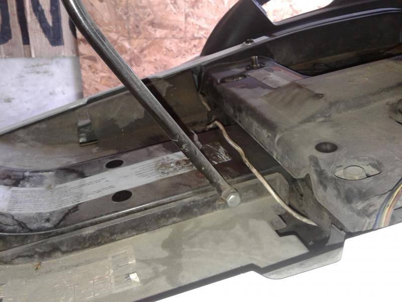 This shows the 5 in. x 1/4 in bolt that goes through the main frame … the holes were there already ( no drilling ) and had push pins in them …. how co