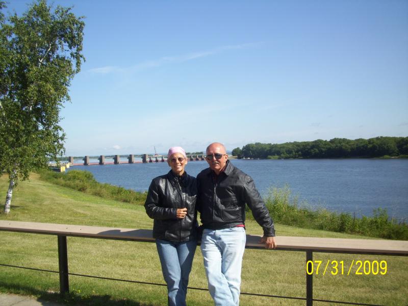 Us at the MN rest area welcome center. The Mississippi River behind.