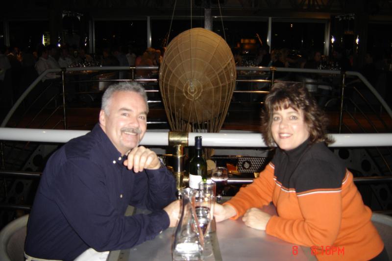 Vickie and I having dinner at the Eiffel Tower in '05.