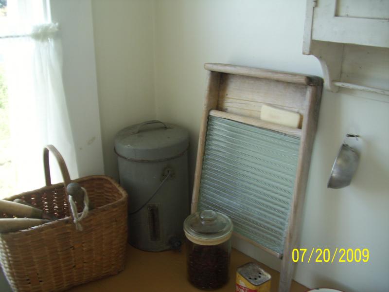 Washboard, cream separator and utensils.