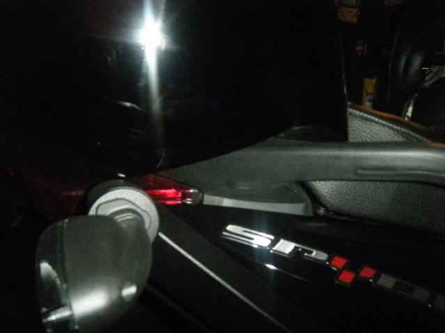 Where the Corbin seat lock is hidden beneath the Corbin topbox.  Yep, the box needs to be uninstalled to pop out the seat!