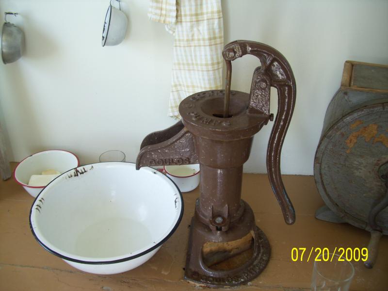 Working hand pump, no running water in the houses and they still burn wood in the stove and bake and cook and clean here.